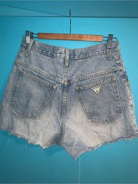 GUESS High Waisted Distressed Denim Shorts in Light Blue